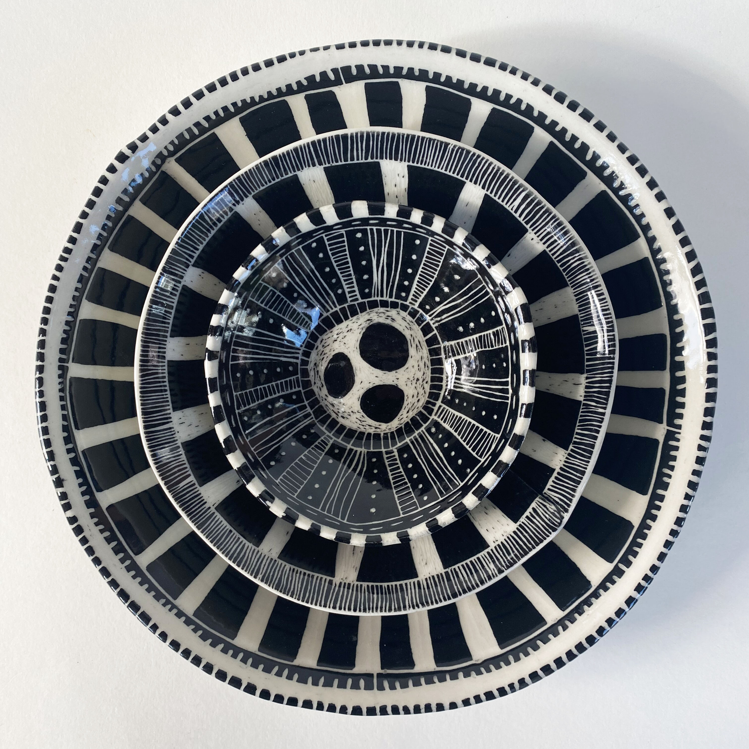 Andryea Natkin’s nesting bowls, 3-piece set: small: 4½ in. (11 cm); medium 6½ in. (17 cm); large: 9½ in. (24 cm) in diameter, porcelain, black underglaze, clear glaze, fired to cone 6, 2020. 