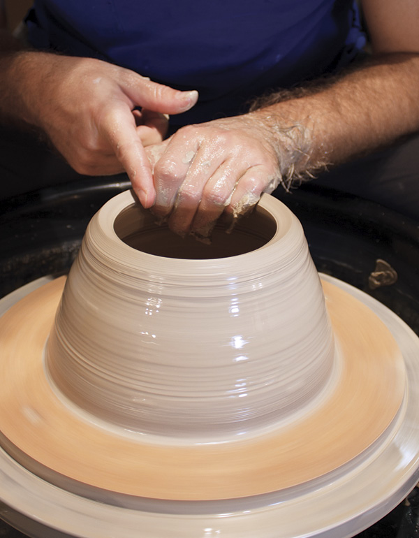 2 Pull the up wall, coning in and compressing the rim after each pass.