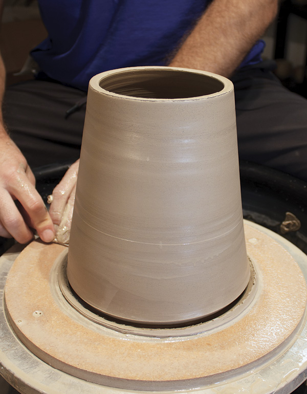 4 Using your wooden knife, create a beveled undercut at the base of the form.