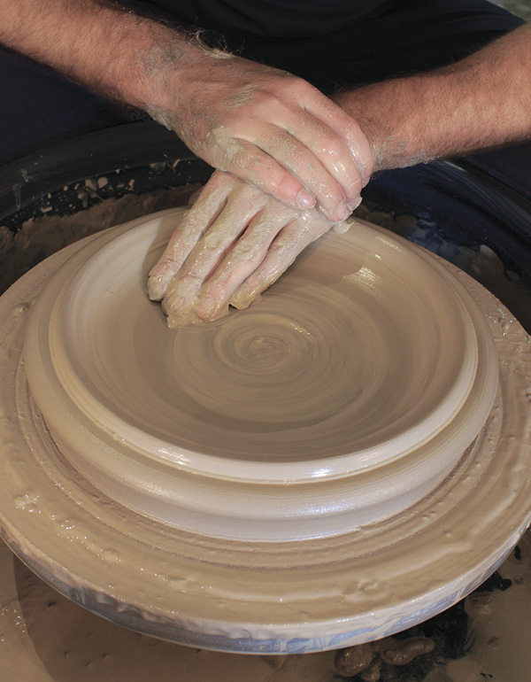 7 Keep the base of the bowl wide to support the wall while throwing.