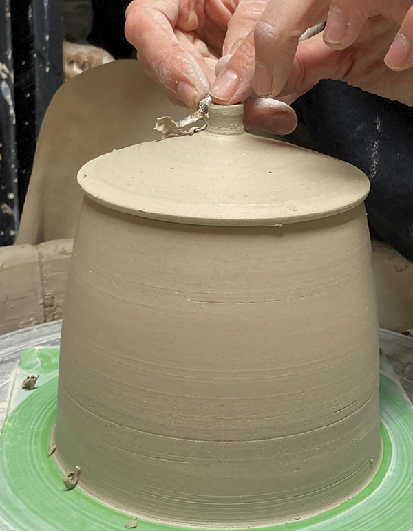 4 Once the lid and lip are trimmed, trim a knob onto the lid.