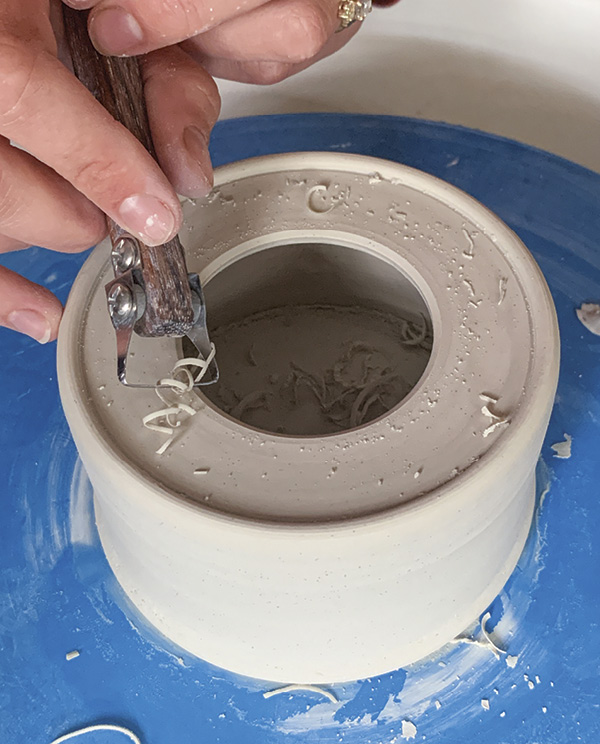 5 Refine your cut hole by rounding out the edges with a trimming tool.