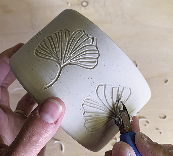 8 Using a loop tool, carve your design about halfway through the thickness of the wall.