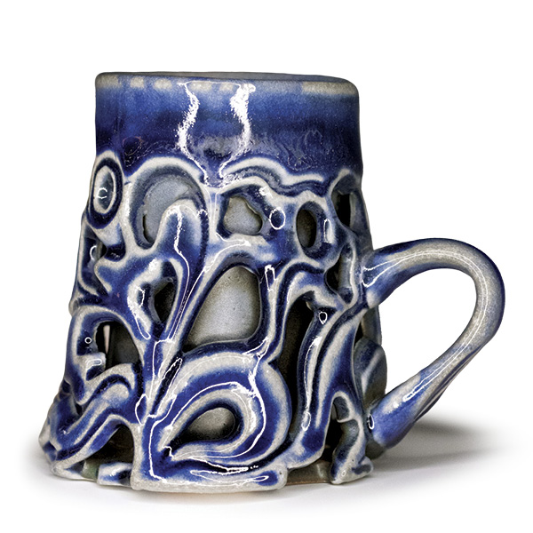 Kaitlyn Cushing's Pierced Mug, 4 in. (10.2 cm) in height, stoneware, fired to cone 10 in a soda kiln, 2025.