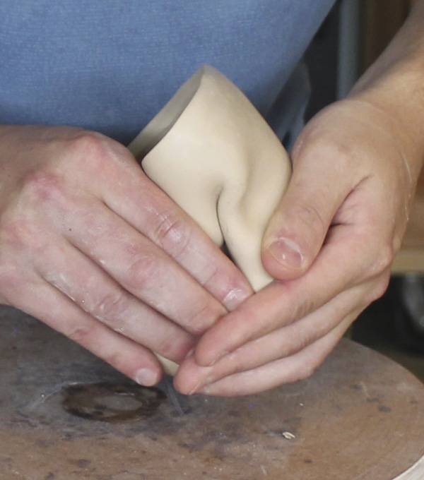 2 Refine the seams and lip, then crumple and tease the soft clay, transforming it into a gestural and expressive form.