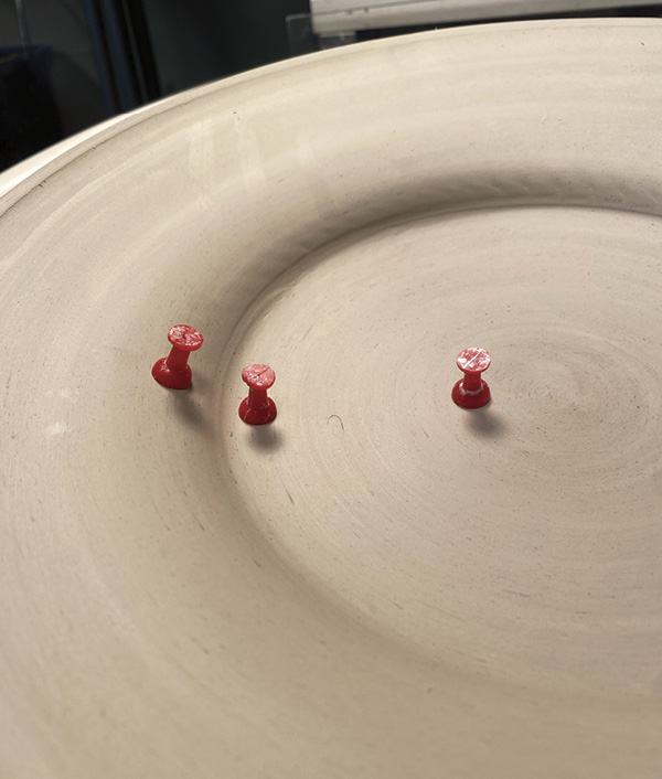 12 Place tacks in several places to gauge the plate thickness while trimming.