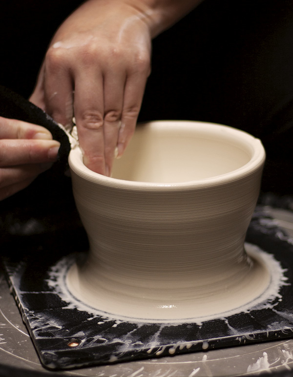 1 Center the clay narrow, tall, and open, leaving a thick base.