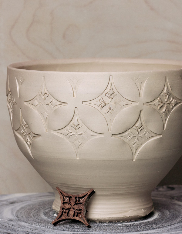 9 Continue stamping the lid until the pattern is continuous and all over.