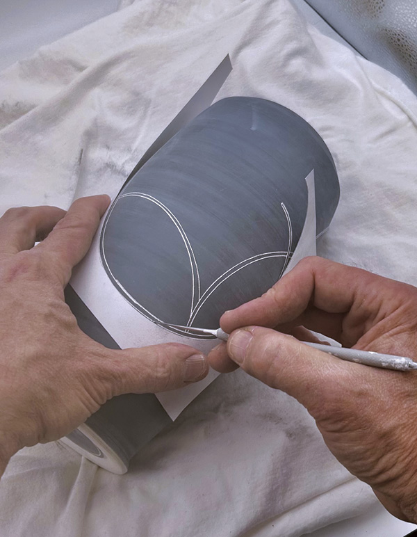 2 Apply a design using a cardstock template and a sharp needle tool.