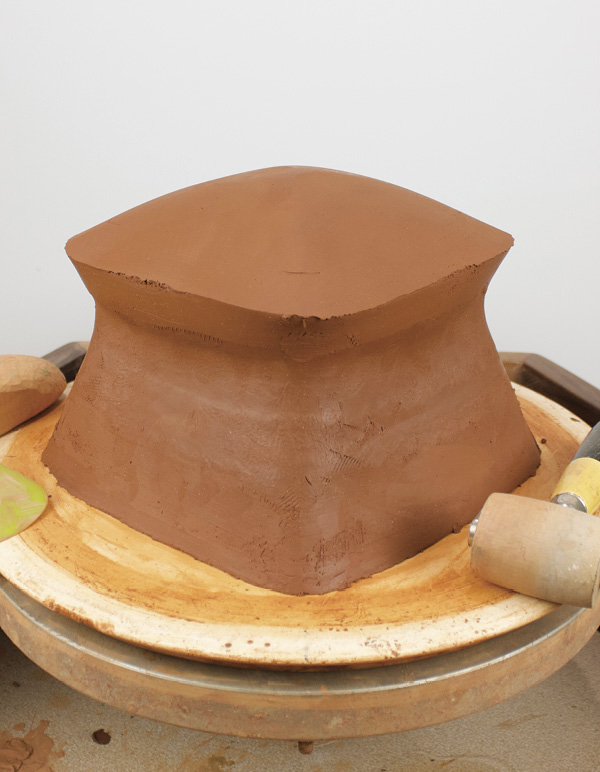 8 Flip the slab, score, and attach domed slab to the squared cylinder.