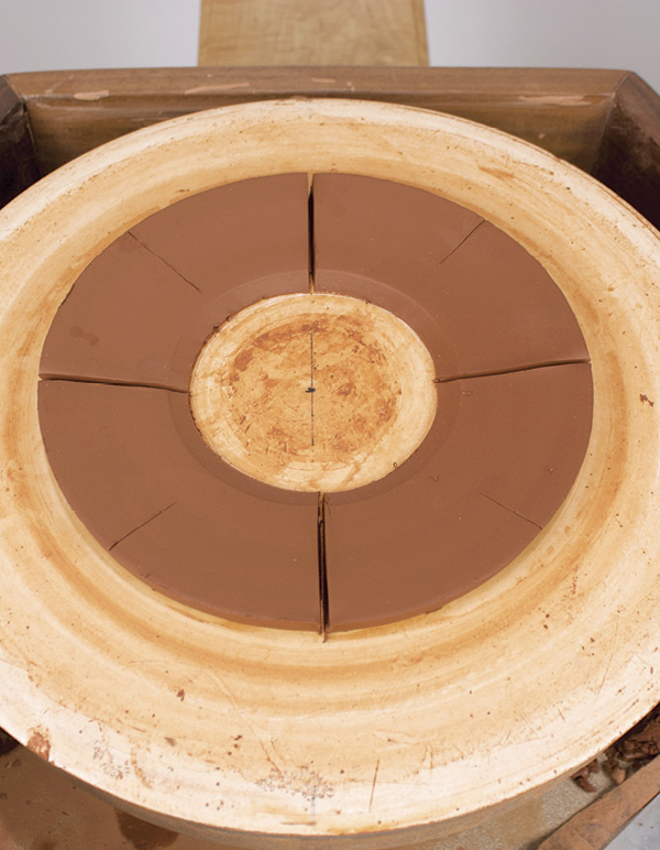 15 Throw ring shape for the feet and mark into four equal sections.