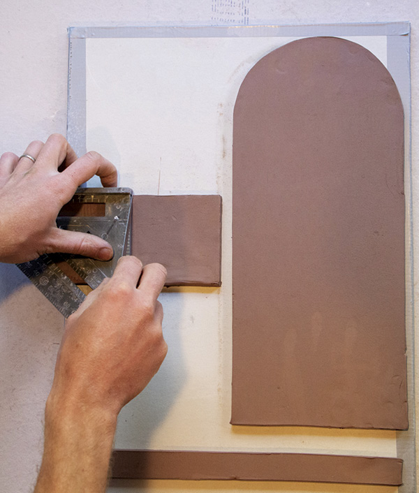 4 Use a speed square to cut right angles on the tray square.
