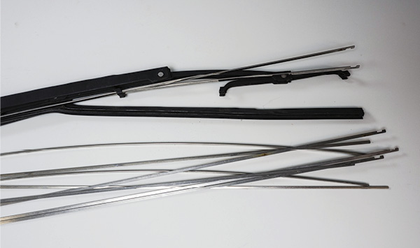 1 Worn-out wiper blades contain a thin, flat, stainless-steel strip that can be used for making loop and cutting tools.