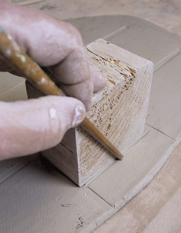3 Define the outer edges of the box layout using a straight edge for precision.