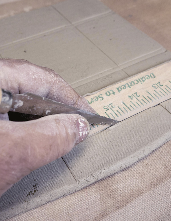 5 Use a fettling knife and a ruler to cut the outer edges.
