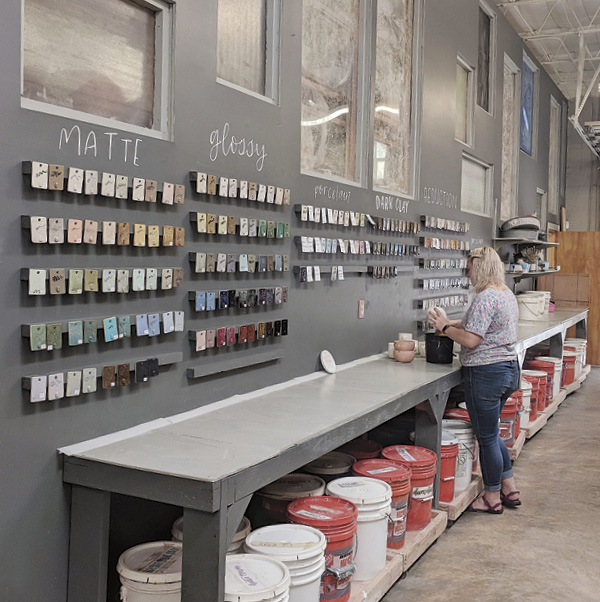 5 Create a materials storage and glazing area with test-tile wall display.