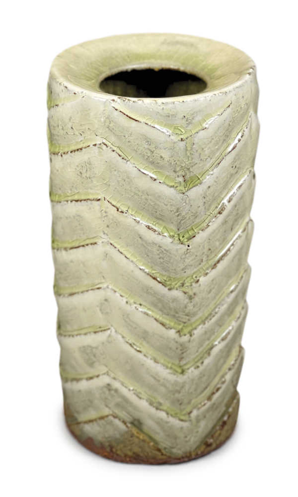 Erik Wilson’s drop-rim vase with chevron pattern, 7 in. (18 cm) in height, red stoneware, white slip, Leach Ash glaze, fired to cone 10 in gas reduction, 2022.