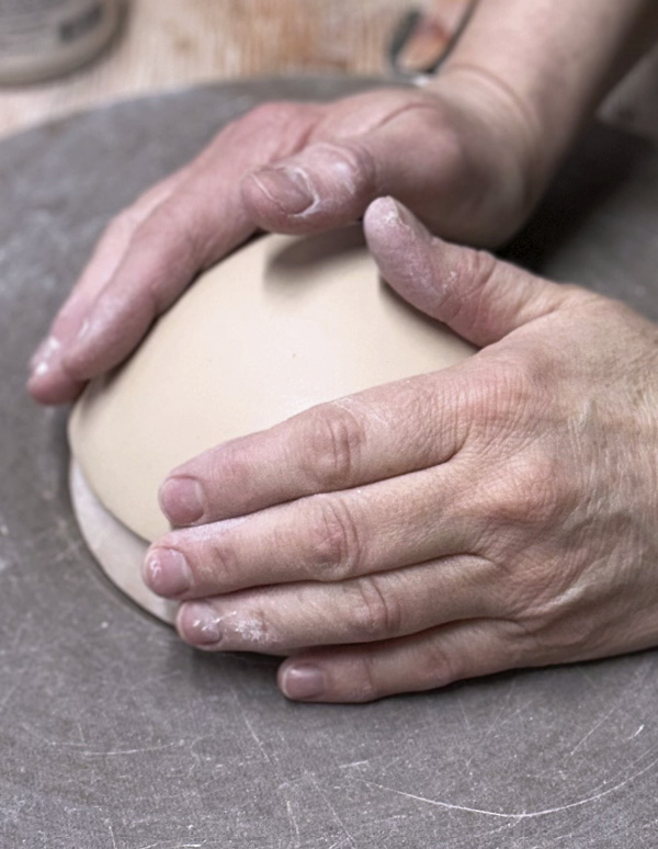 4 Use a bisque hump mold to shape and firm up the bowl.