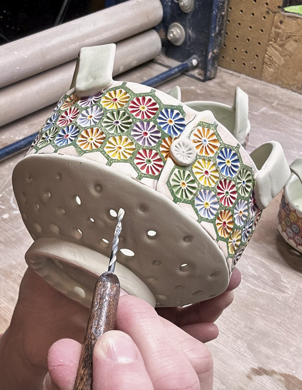 15 Clean out any excess glaze from the holes using a cleaning tool or a drill bit.