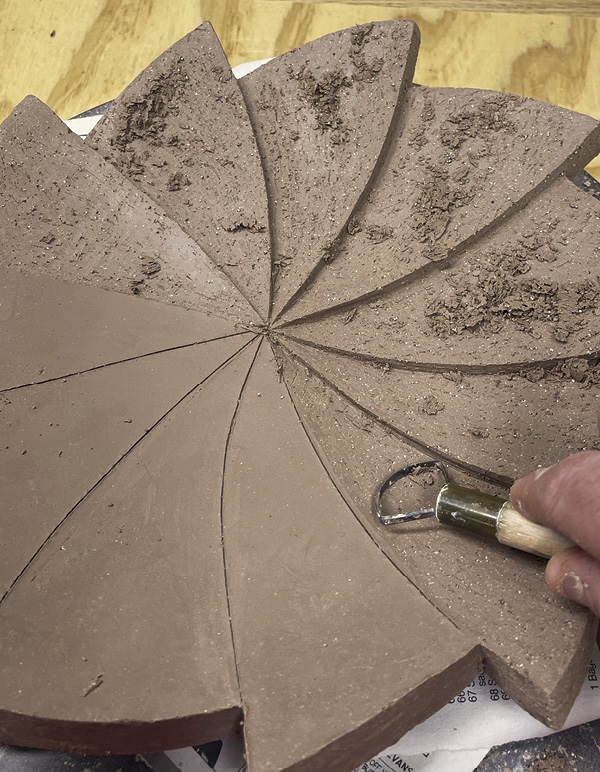9 Use a curved loop tool to gradually remove material in each segment.