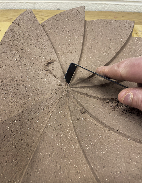 11 Achieve consistent line depth and sharpness gradually through scraping.