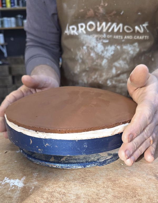 1 Cut a slab for the lid then place it on a hump mold to shape it.