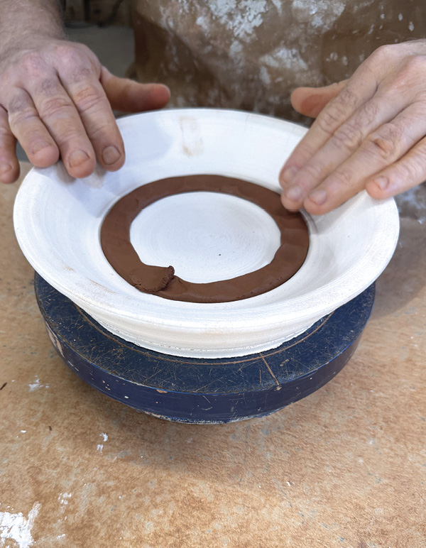 2 Add a coil to a second slump mold with a built in foot ring. Compress the coil.