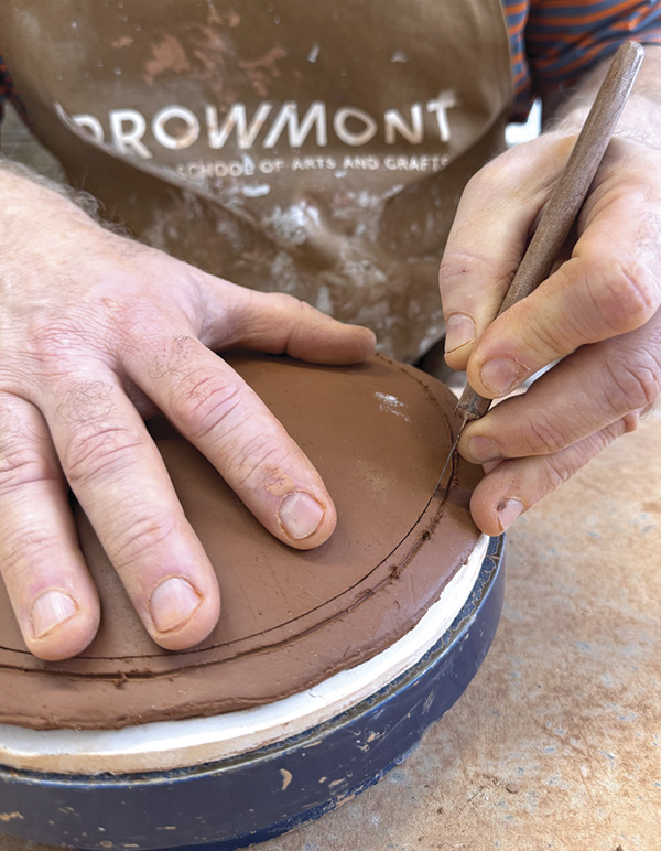 13 Place the lid back on the mold and cut it to size.