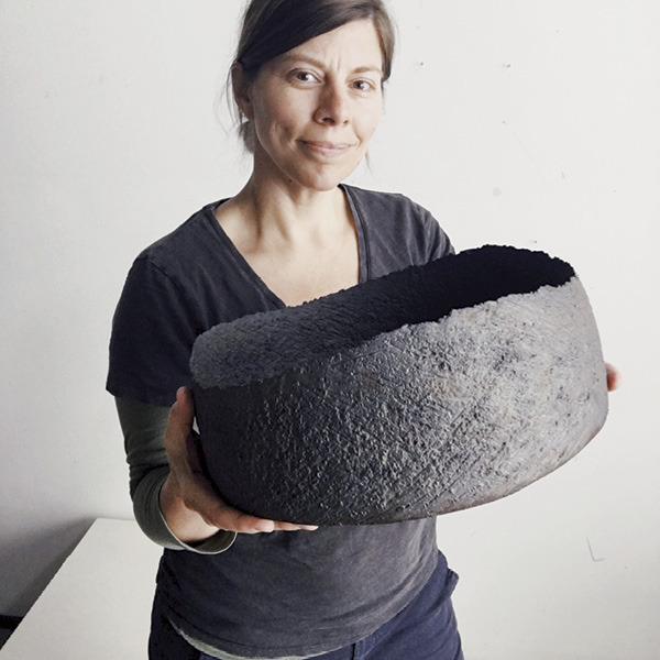 Erica Iman with a Caldera bowl, stoneware, glaze, fired to cone 6 in an electric kiln, 2022.