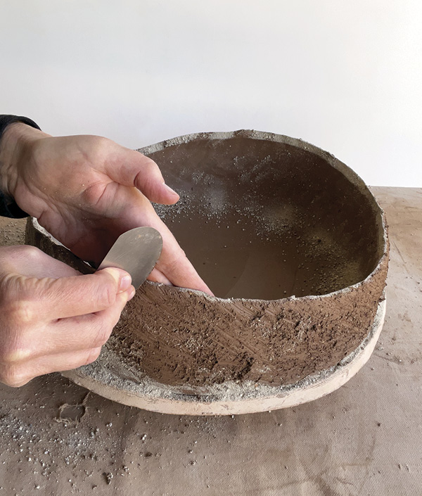 12 Bend your rib into a curve by pressing your thumb on the inside and fingers on the outside while you scrape the walls.