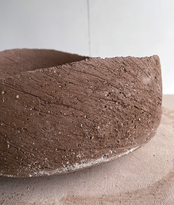 14 Pay attention to the exterior wall’s slight curve inward as you scrape and refine the form and texturize.