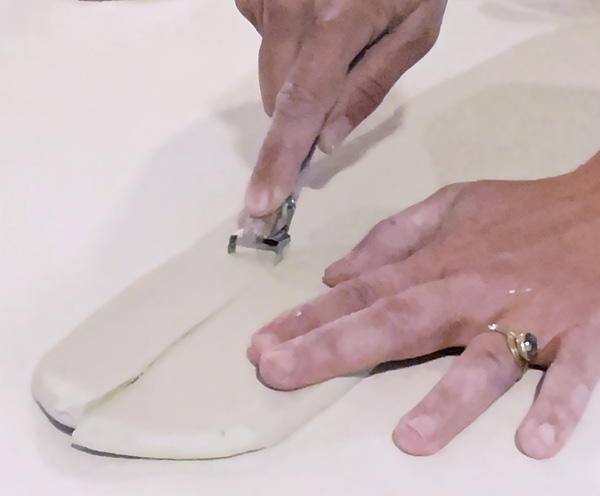 4 Cut a foot for the plate using a DiamondCore hand extruder or loop tool from a thick slab.