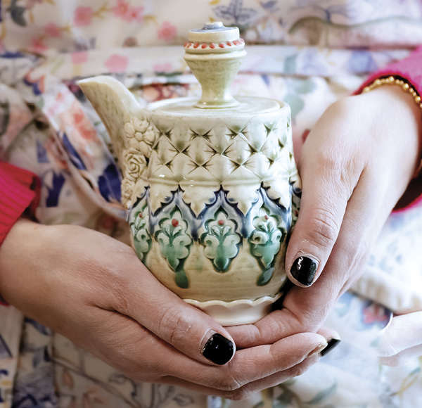 Use slip-trailed dots and glaze colors to further accentuate  the pattern.