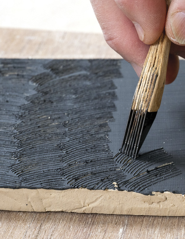 5 Using a sharp, thin knife, make repeated scratches through the set-up slip.