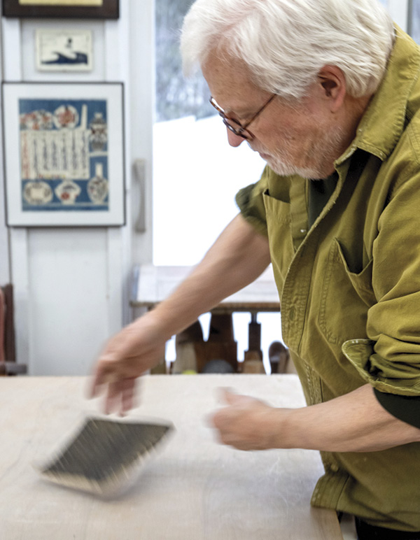 7 Rotate your slab, slip side up, as you continue to stretch and thin your clay.