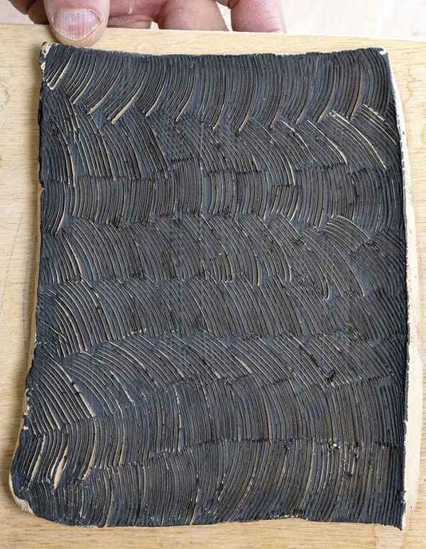 8 As you continue to throw and thin your slab, the marks made by your blade will continue to open up creating a high-contrast pattern.