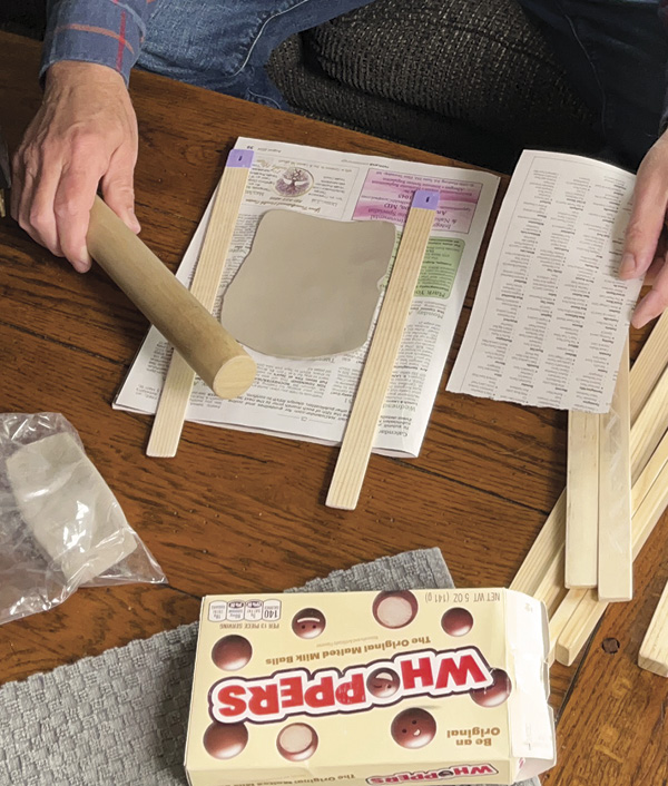 1 Find a workspace to prepare your clay slabs and neck. Use wood spacers to roll three thin sheets of clay.
