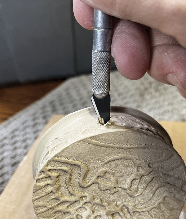 16 Once assembled, twist a sharp knife blade into the neck to create a round neck hole.