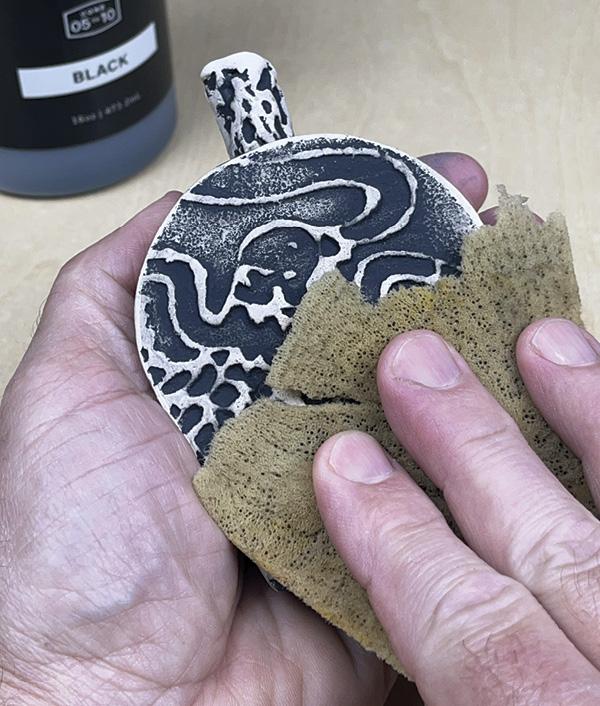 21 Clean off the ceramic high-points with a sponge to reveal the texture. Brush a layer of Liquid Quartz to the exterior.