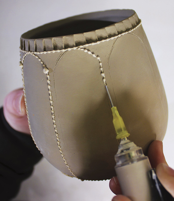 3 Use an AirPen, or bulb applicator, to slip trail dots along the guidelines.
