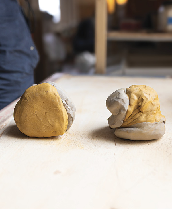 1 Roughly wedge two different clay bodies together, in alternating directions.