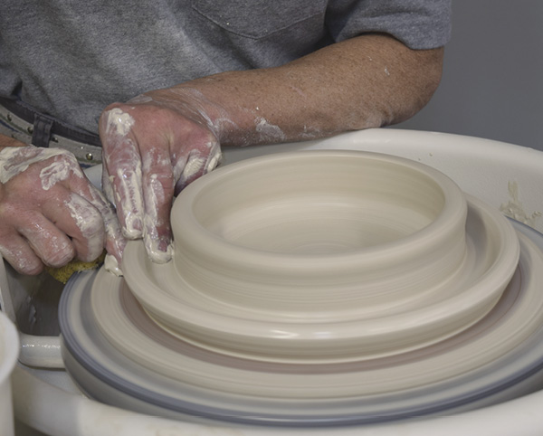 3 Finish the saucer, making it generous but sturdy. Cut the inner wall at an angle facing inward.