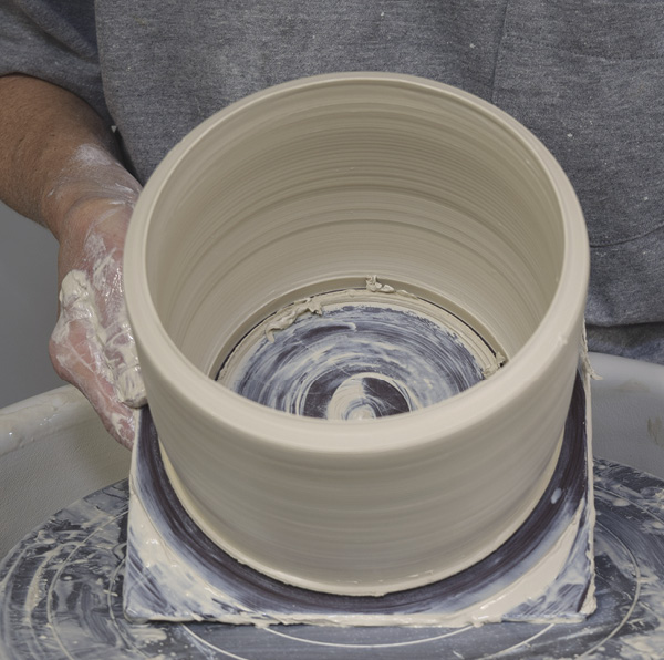 6 Measure the top to make sure it matches your caliper measurement. Cut just inside the cylinder with a wood tool.
