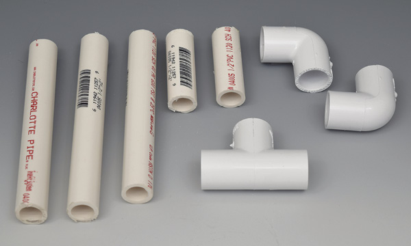 2 Cut the PVC pipe into five sections: two 6⅜ inches (16.2 cm), one 6 inches (15.2 cm), and two about 2½ inches (6.4 cm) long.