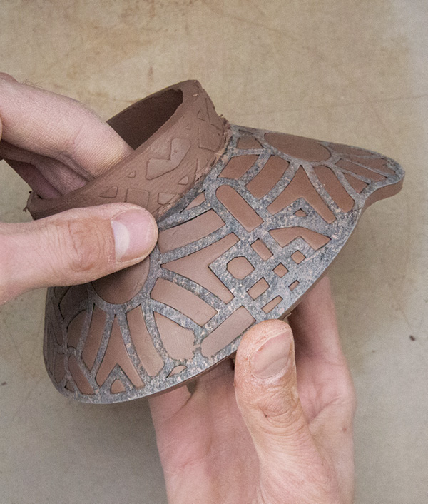 11 Firmly pinch against the template and inside around the base of the spike to join the two components.