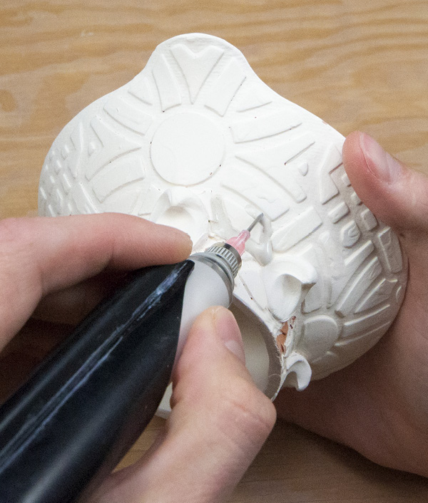 15 Use a small-nibbed squeeze bottle to squirt glaze into the recessed patterned areas.