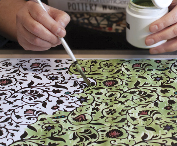2 Brush colored terra sigillata on the white areas of the print. The black areas resist the terra sigillata. Let it dry.