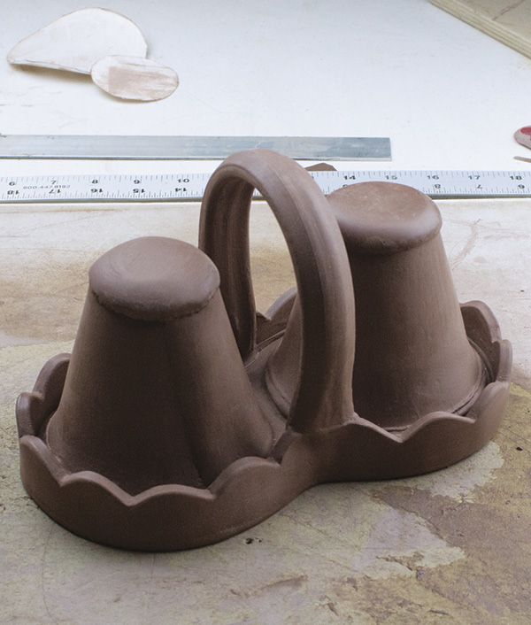 11 Use a paintbrush, blending tool, or rubber rib to clean up any extraneous marks on the pieces as needed.