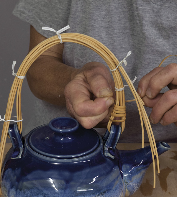 5 Coil the binder cane around the base of the handle, trapping the end under the coils and tighten.