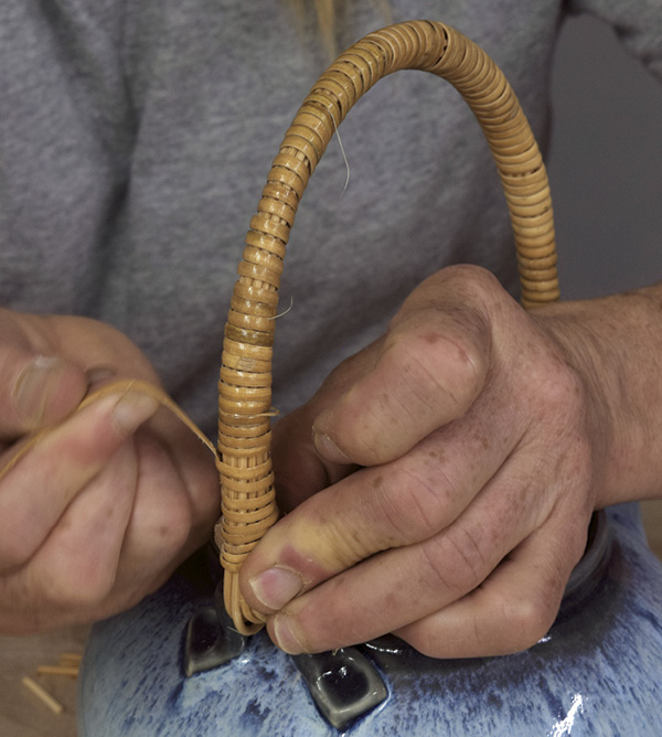 12 Tighten the end of the binder cane before cutting it to create a finished teapot handle with hidden ends.